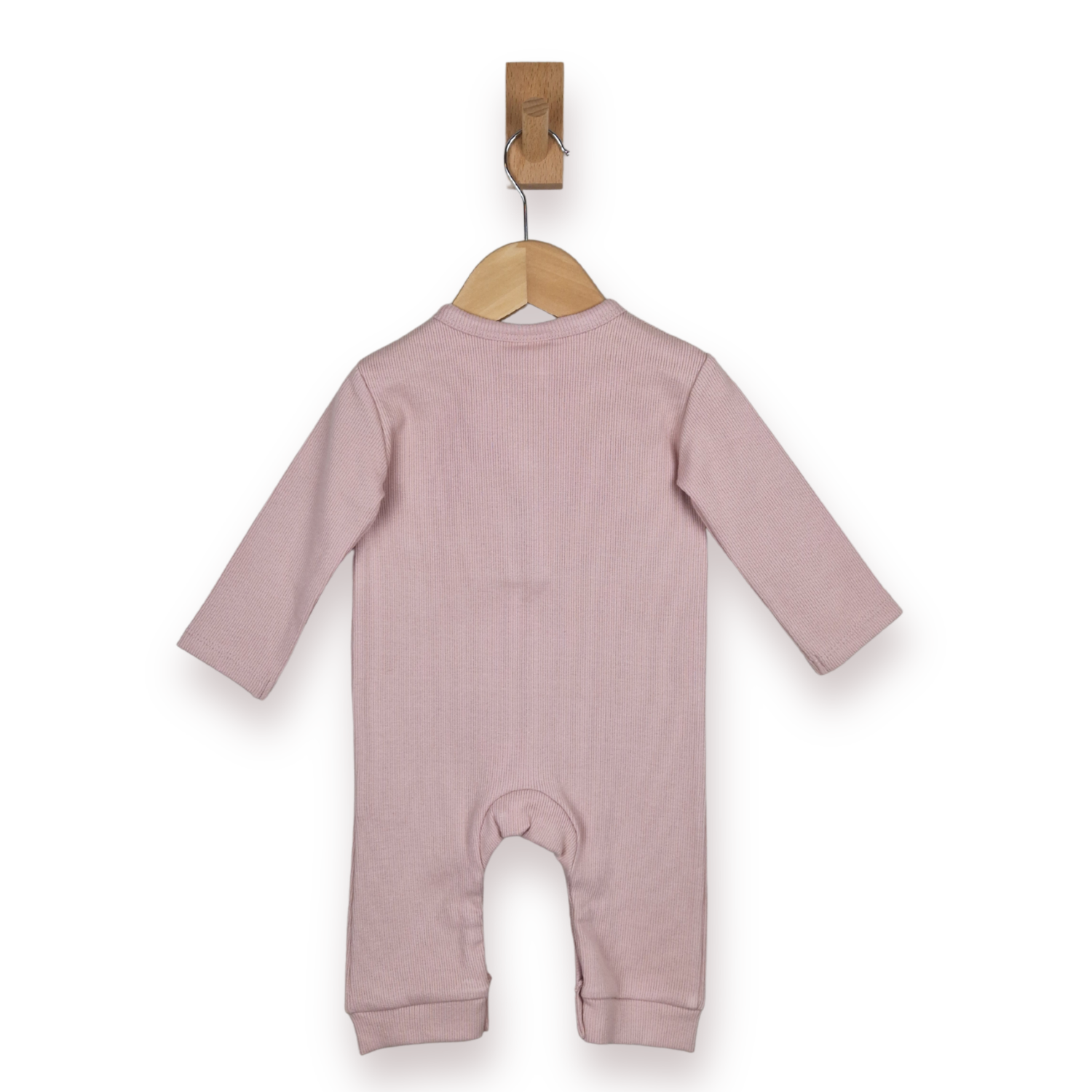 A dusty pink long-sleeve baby jumpsuit or footless romper hanging from a wooden hanger on a white background.