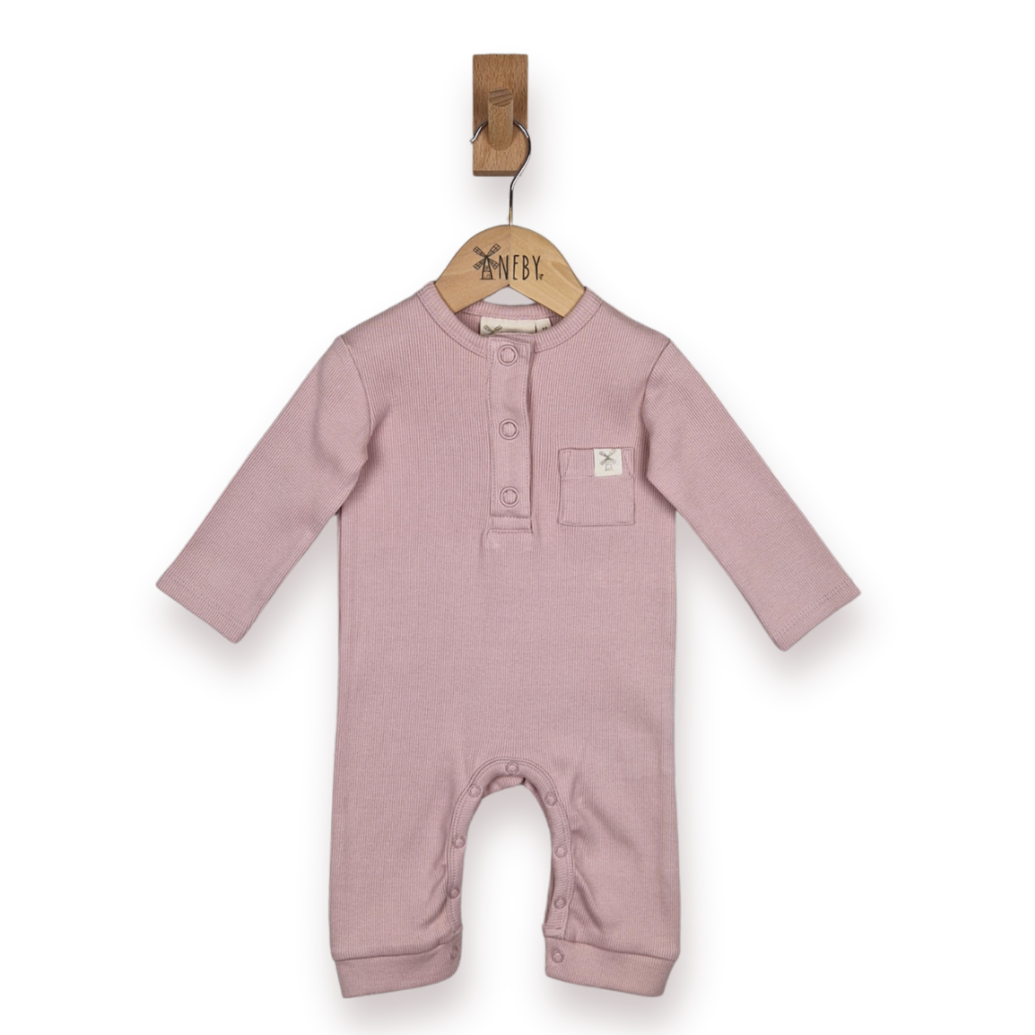 A dusty pink baby long-sleeve romper hanging on a wooden hanger, set against a plain white background.