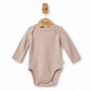 A long-sleeve baby bodysuit in a light beige color, hanging on a wooden hanger against a clean white background.