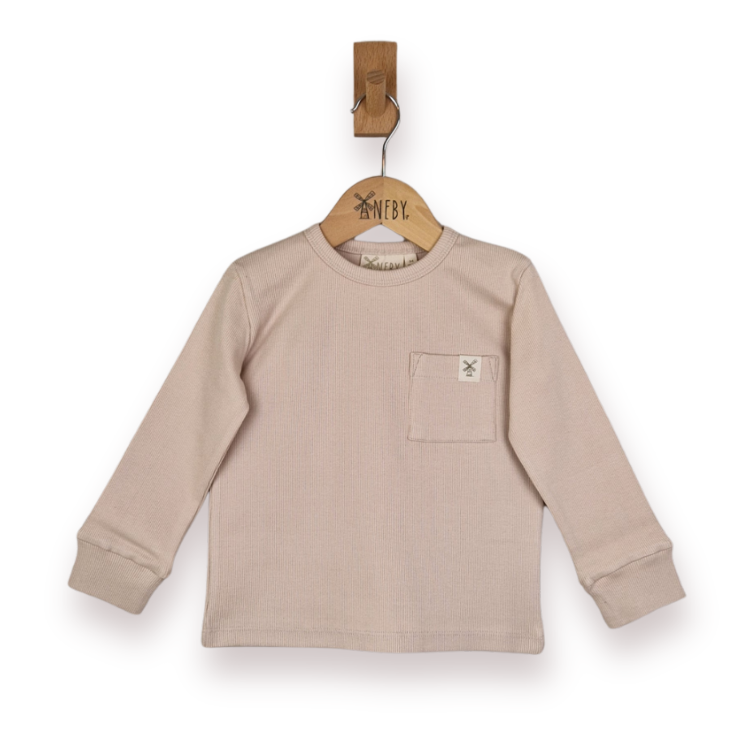A light beige long-sleeve crewneck shirt with a chest pocket, hanging on a wooden hanger against a plain white background.