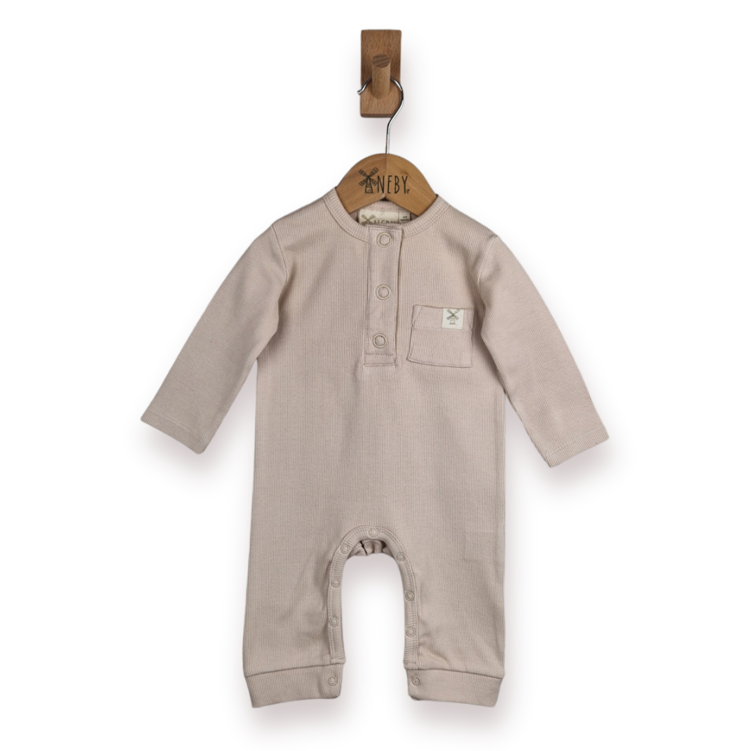 A light beige long-sleeve baby romper with a buttoned neck and a chest pocket, hanging on a wooden hanger , against a plain white background.