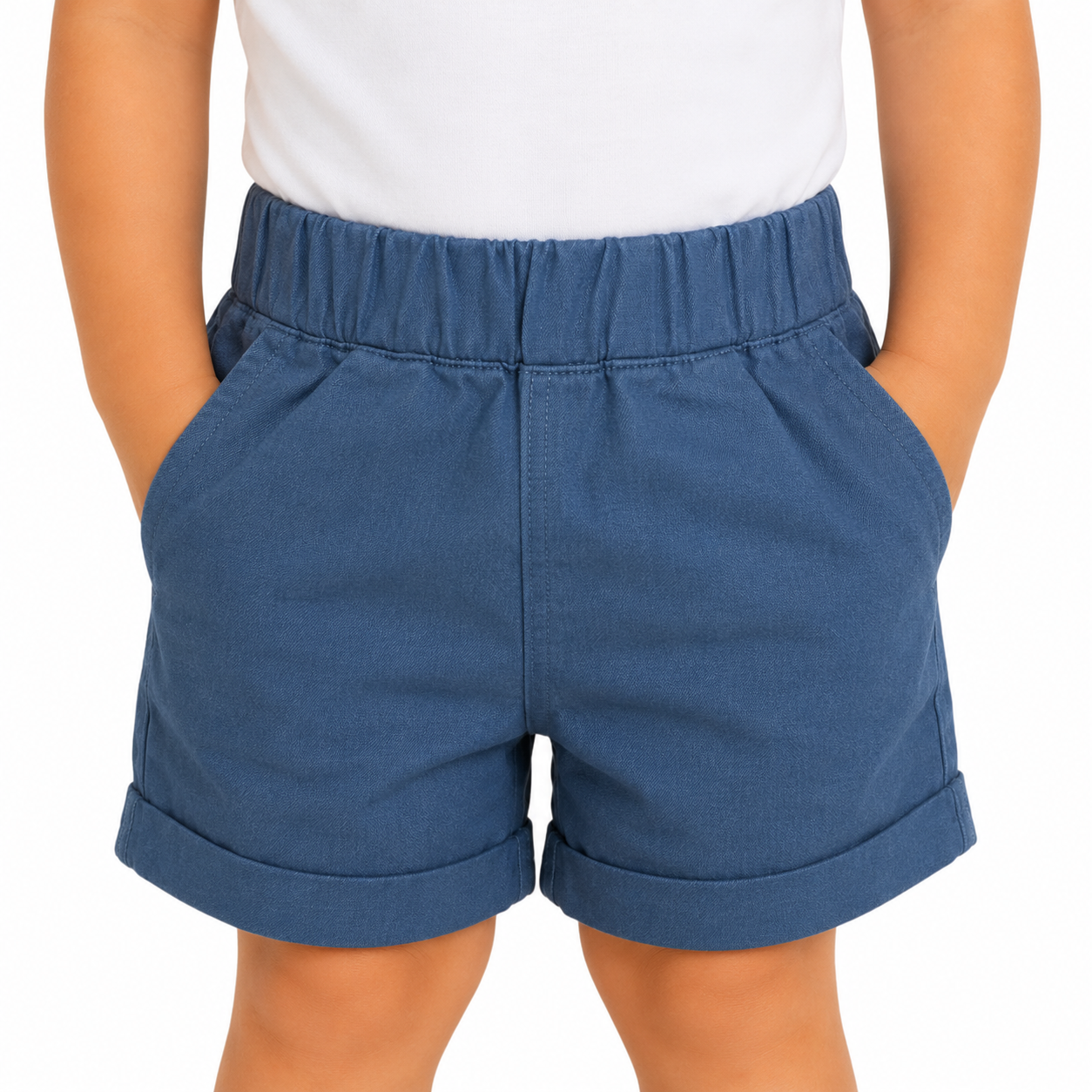 A child wearing a pair of blue elastic-waist shorts with rolled cuffs, paired with a white top, shown from the chest to the thighs against a plain white background.