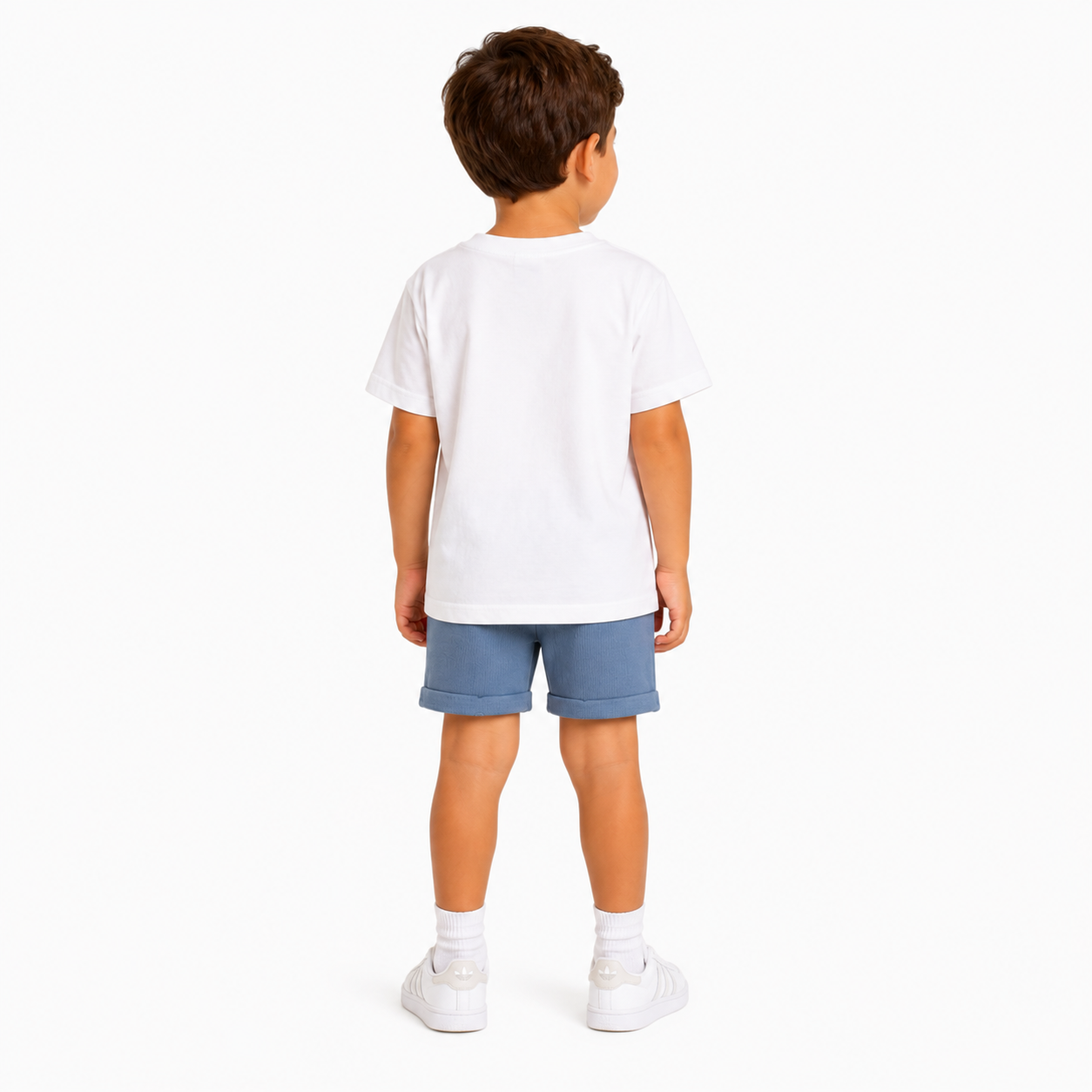 A child model shown from the back wearing a plain white short-sleeve t-shirt, blue shorts, white socks, and white trainers against a clean white background.