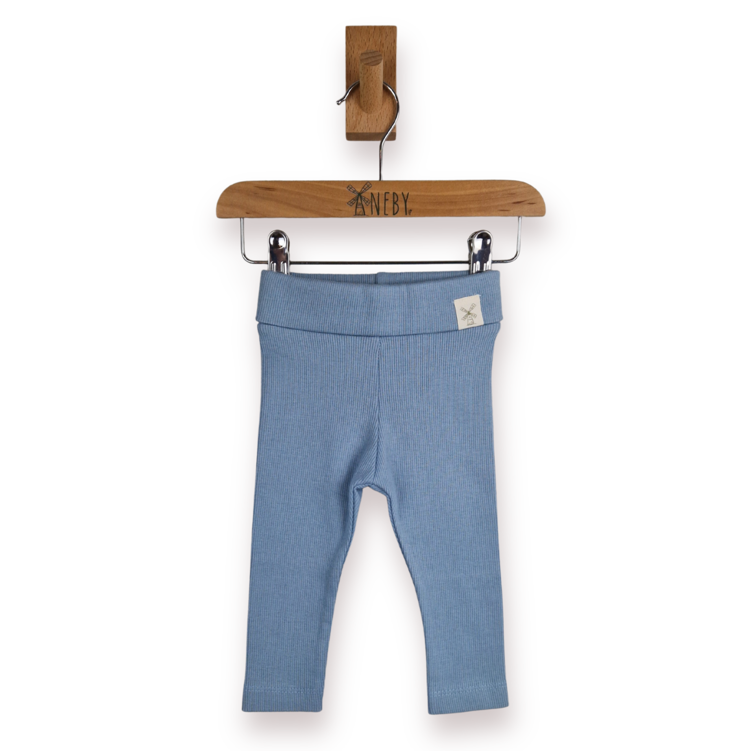 Light blue ribbed knit baby leggings hanging from a wooden hanger with the brand name Aneby visible on the hanger, against a plain white background.