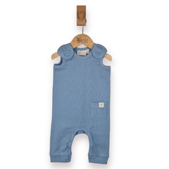 A light blue baby romper with shoulder poppers and a small front pocket, hanging on a wooden hanger, against a plain white background.