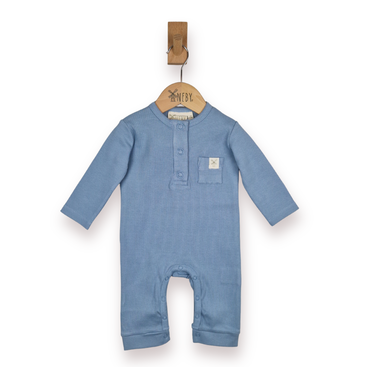 A baby long-sleeve romper in dusty blue, hanging on a wooden hanger from a wall hook against a white background.