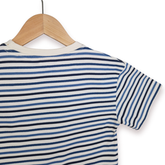 Striped shirt on a wooden hanger against a white background