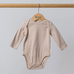 Neutral oat long sleeve jersey rib bodysuit on wooden hanger