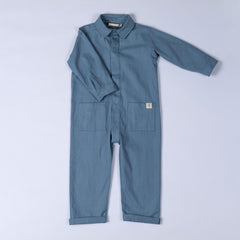 Product shot of the blue oat kids boilersuit with Aneby hem tag