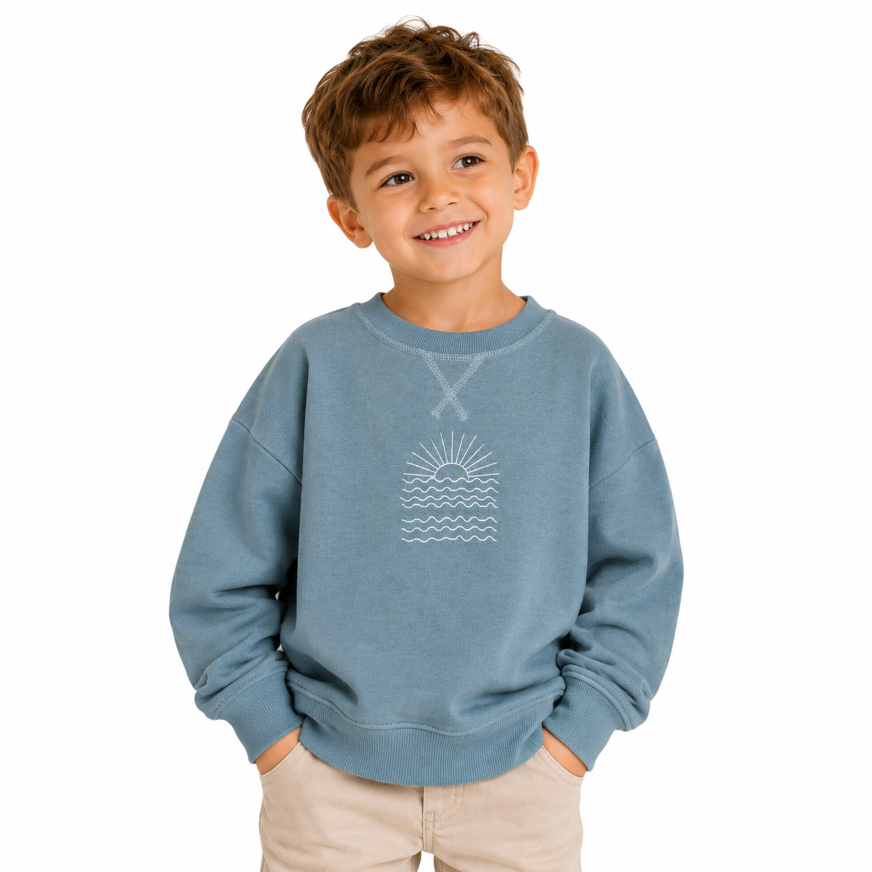 Child wearing a blue sweatshirt with a graphic design on a white background