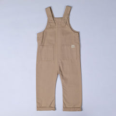 Beige dungarees from Aneby with windmill hem tag on front patch pocket