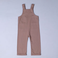 Rear view of dusty pink dungarees with shoulder straps and rolled hem