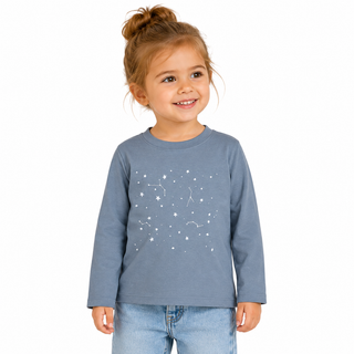 Child wearing a blue long-sleeve shirt with star patterns on a white background