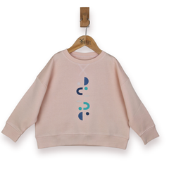 Pink sweatshirt with abstract designs on a hanger against a white background