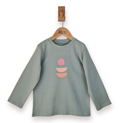 Green long-sleeve shirt with pink and orange abstract design on a hanger against a white background