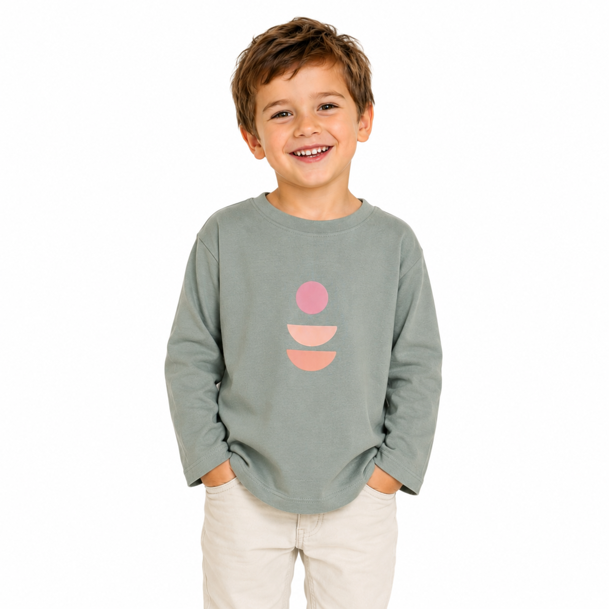 Child wearing a green long-sleeve shirt with pink and orange abstract design on a white background