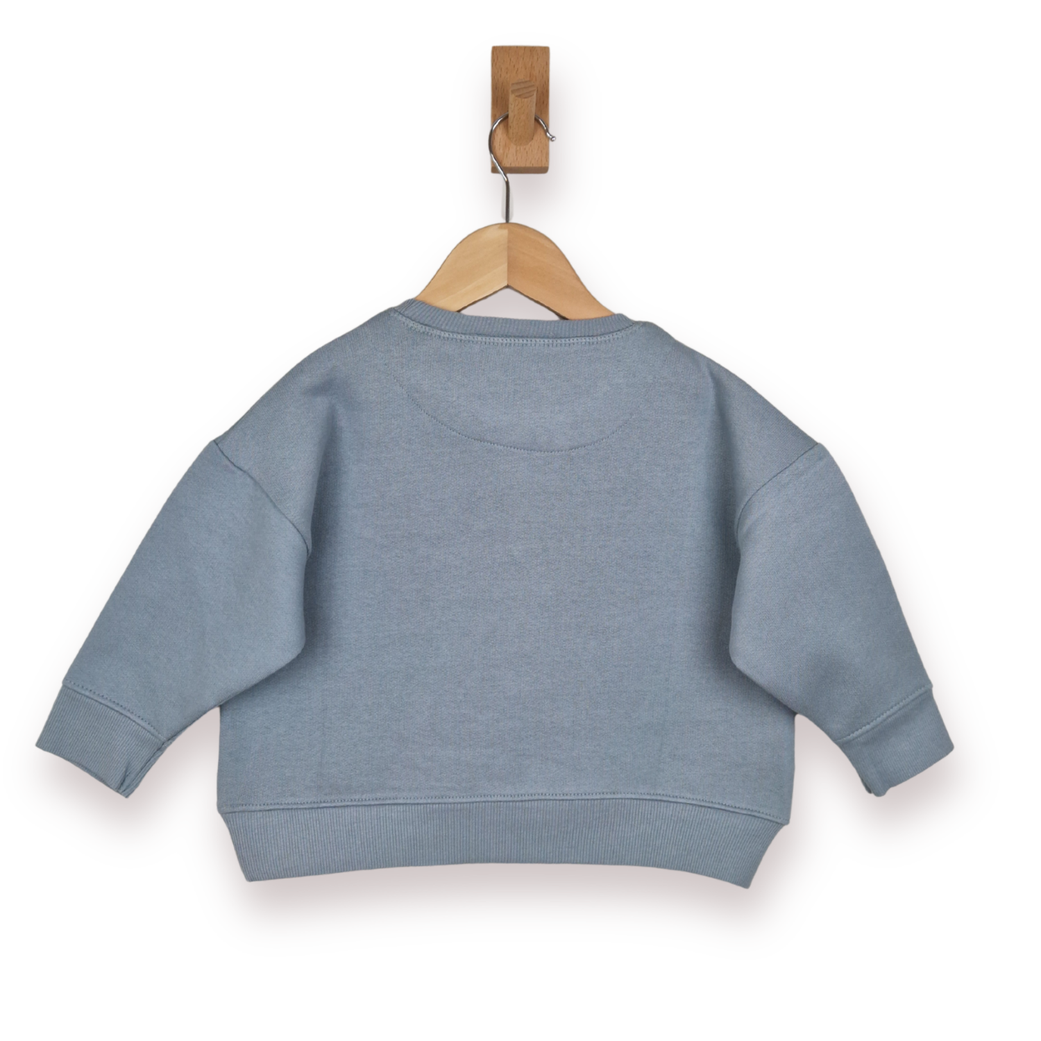 Blue sweatshirt on a wooden hanger against a white background
