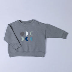 Procut photo of grey sweatshirt from Aneby featuring 6 unique moon designs