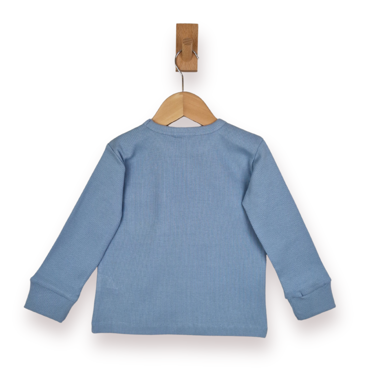 A light blue long-sleeve rib knit top shown from the back, hanging on a wooden hanger with a wooden peg against a plain white background.