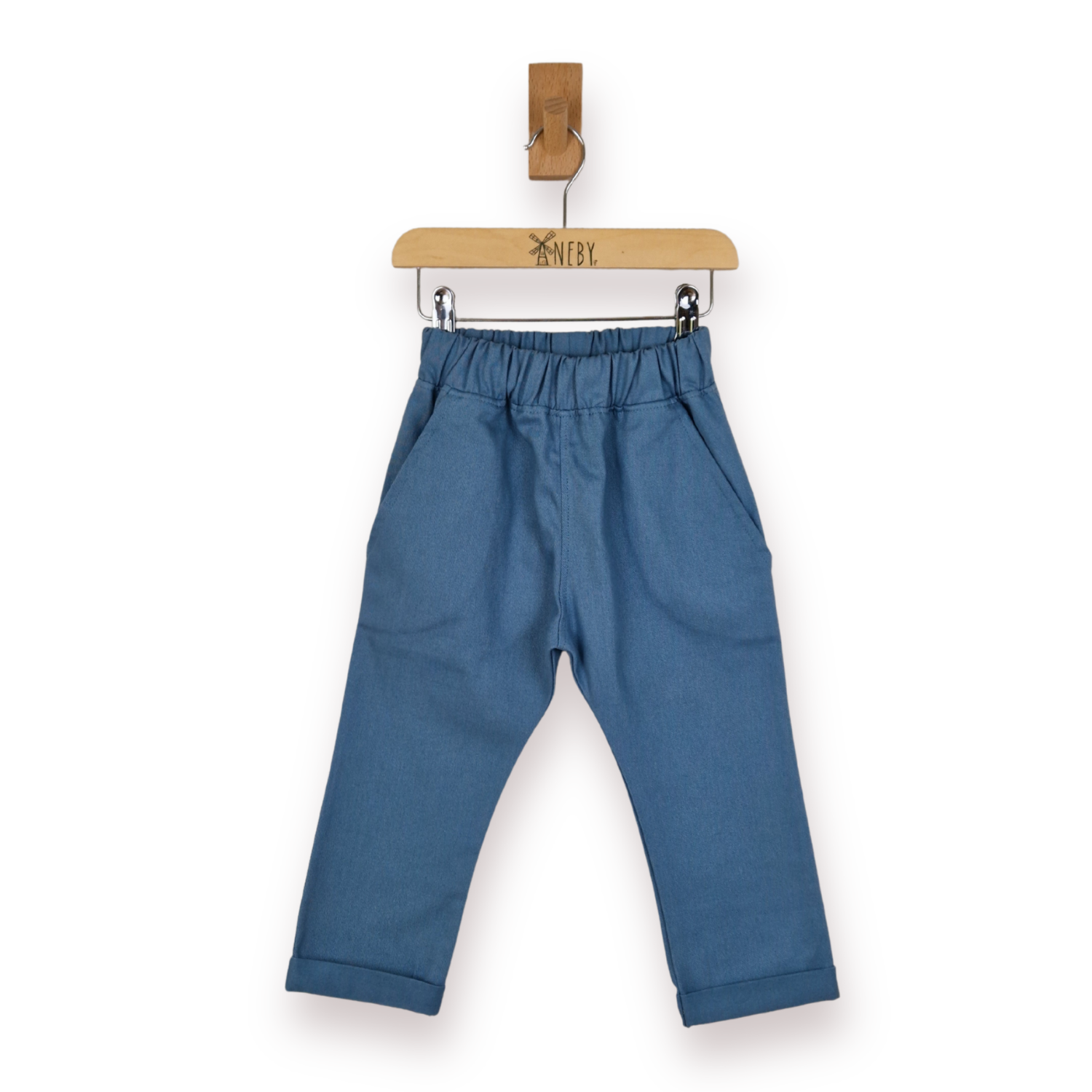 Blue toddler trousers with an elastic waistband and pockets, displayed on a wooden hanger against a white background.