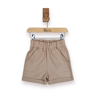 A pair of beige elastic-waist shorts with side pockets, hanging from a wooden hanger branded 'ANEBY' on a white background.