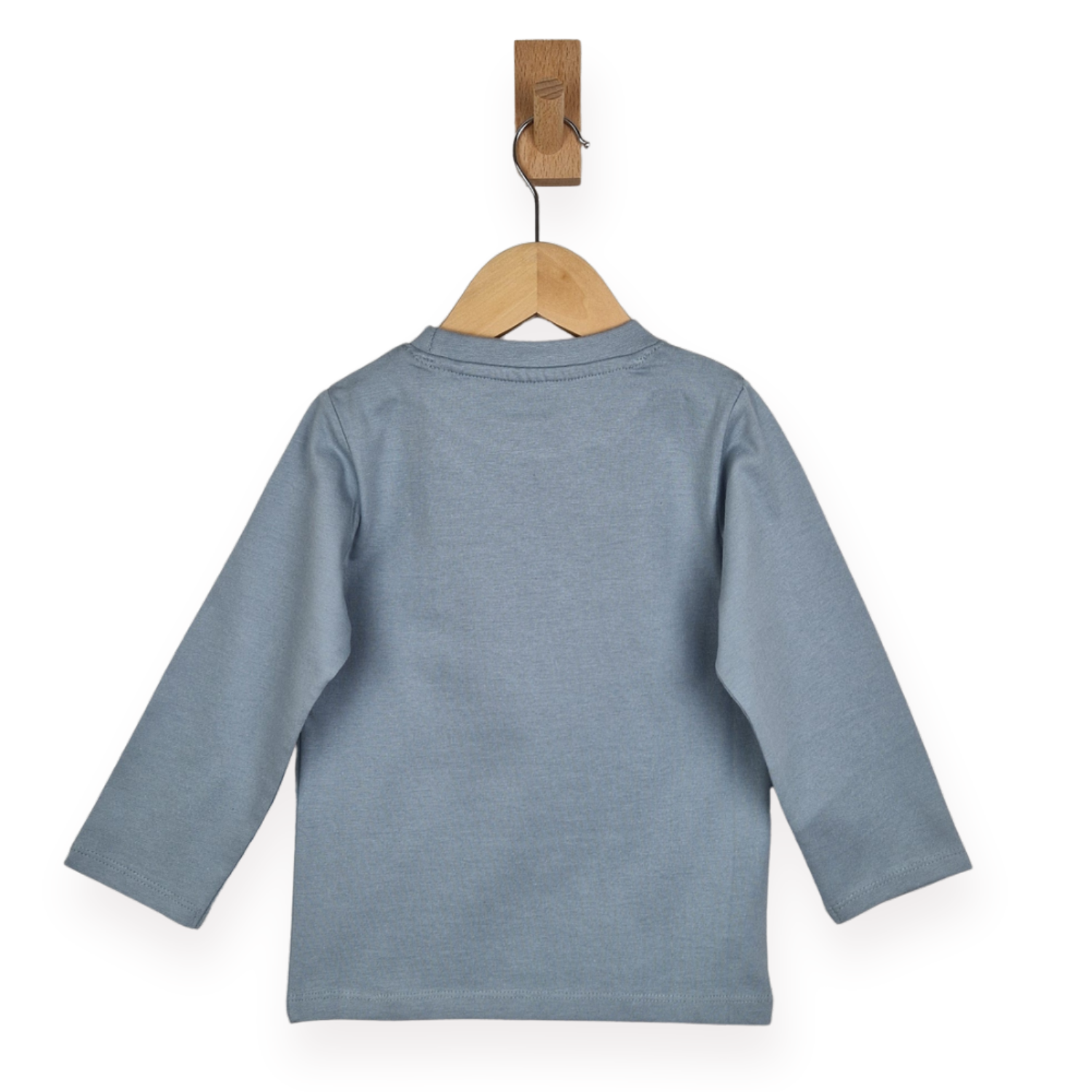 Blue long-sleeve shirt on a wooden hanger against a white background