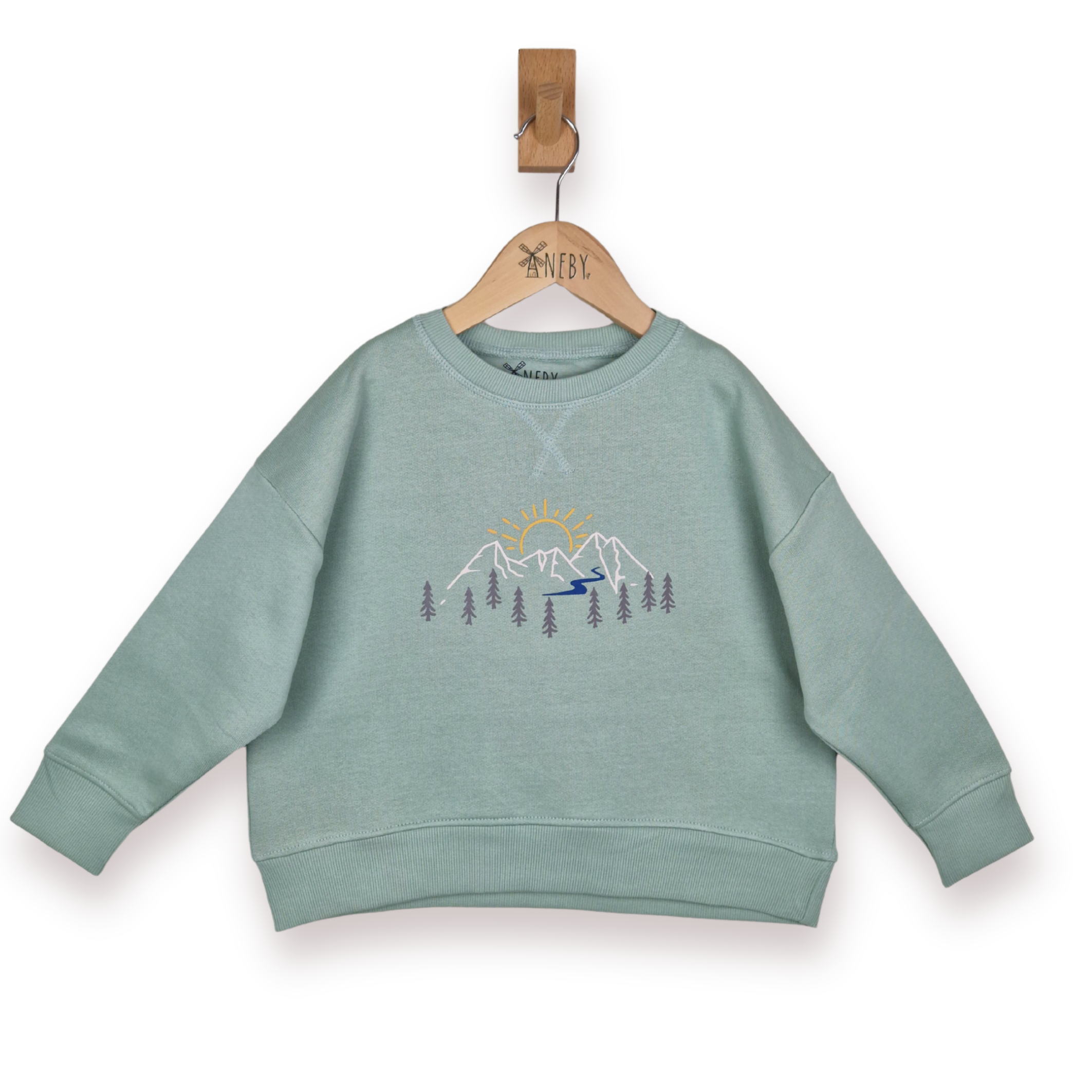 Green children's sweatshirt with mountain design on a hanger against a white background