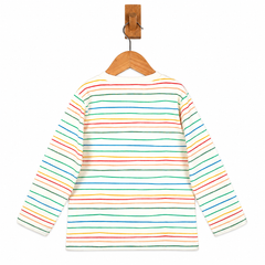 A long-sleeve children's shirt with horizontal rainbow stripes in red, orange, yellow, green, blue, and purple on an off-white base, hanging on a wooden hanger from a wooden peg against a white background.