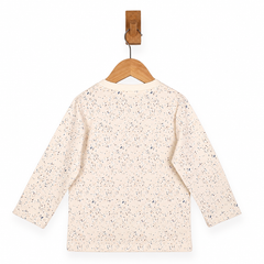Speckled long-sleeve shirt on a wooden hanger against a white background