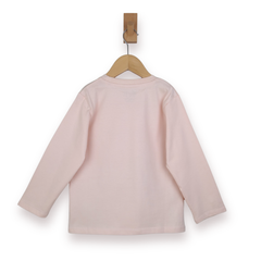 Pink long-sleeve shirt on a wooden hanger against a white background