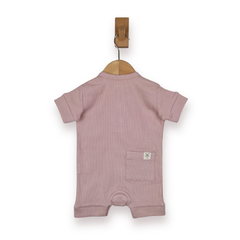 A baby short-sleeve romper in dusty rose pink, hanging from a wooden hanger on a white background.