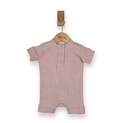 A baby short-sleeve romper in dusty pink, hanging from a wooden hanger on a white background.