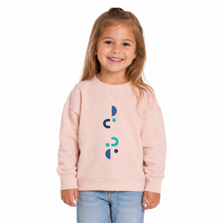 Child wearing a light pink sweatshirt with a colourful design on a white background