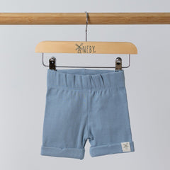 Blue shorts with a rolled hem and Aneby tag featuring the windmill logo