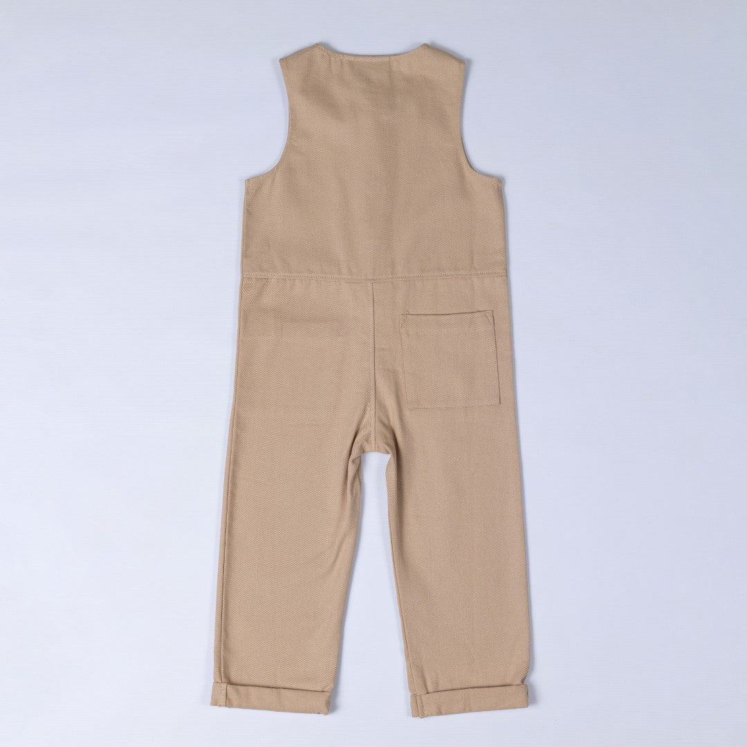 Rear view of twill sleeveless jumpsuit in beige with waist seam and square patch pocket