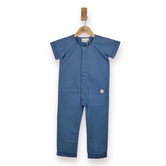 A child's short-sleeve blue jumpsuit hanging on a wooden hanger against a plain white background.
