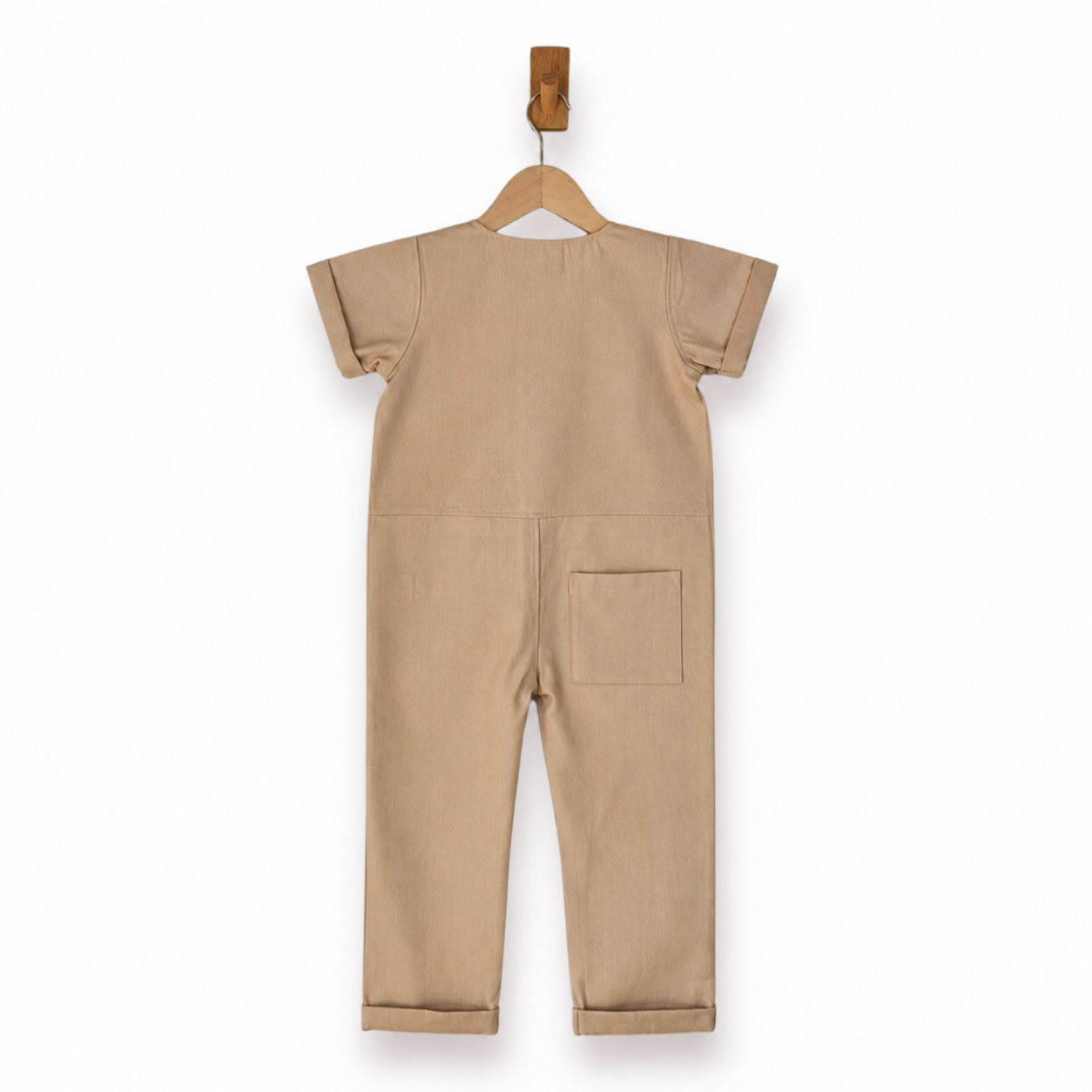 A beige short-sleeve one-piece jumpsuit shown from the back, hanging on a wooden hanger against a plain white background.