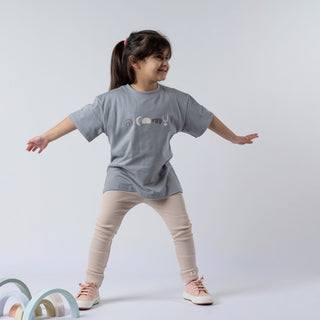 Girl modelling the grey tee from Aneby featuring a unique Aztec design