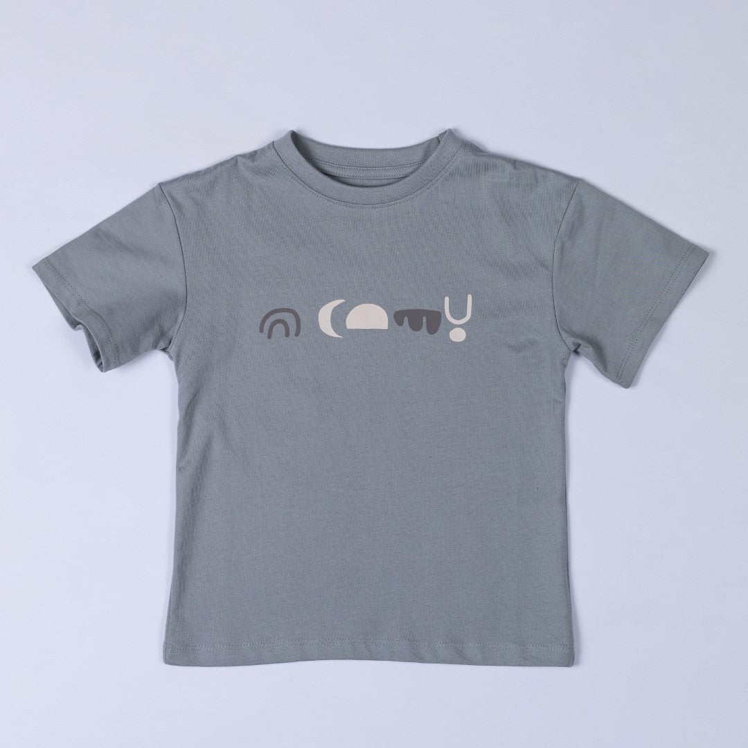 A kids abstract t-shirt laid flat, displaying its geometric pattern in earthy tones. The design features angular shapes arranged in a symmetrical layout.