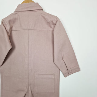 Back view of a dusty pink twill kids boilersuit, designed for everyday comfort and play.