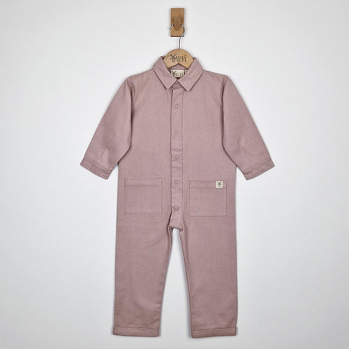 Dusty pink twill kids boilersuit, front view, featuring soft, breathable organic fabric.