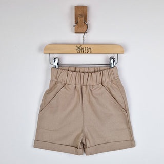 Oat elasticated chino shorts hanging, front view, neutral background.