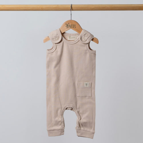 Oat-coloured sleeveless rib baby romper hanging on a wooden frame, front view. Neutral background.